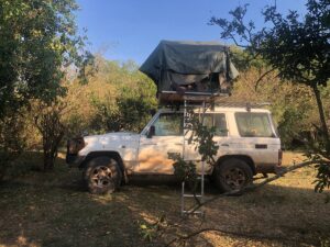 a landcruiser with the rooftop tent